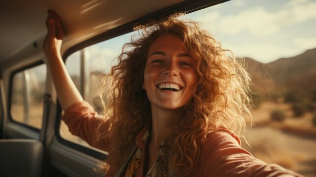 Happy woman stretches her arms while sticking out car window. Lifestyle, travel, tourism, nature, car, person, travel, females, summer, happy.