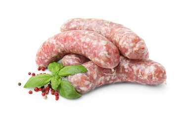 Raw homemade sausages, basil and spices isolated on white