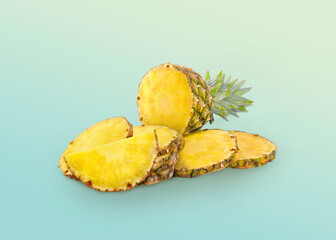 Cut fresh juicy pineapple on light blue background