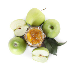 Glass jar of delicious apple jam and fresh fruits isolated on white, top view