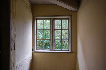 Interior view at the stairway and windows of traditional danish wooden houses.