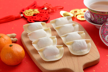 Delicious dumplings on a red background in China. The Chinese meaning in the picture is: Blessings and endless life