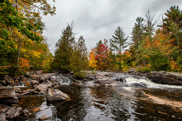 Waterfalls flowing into Lake of the Falls in Mercer, Wisconsin in September