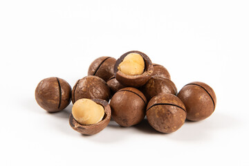 macadamia nuts isolated on white background. - obrazy, fototapety, plakaty