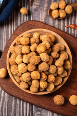 flavored peanuts or crunchy Peanut in a plate on table.