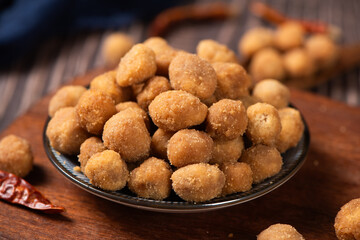 flavored peanuts or crunchy Peanut in a plate on table.