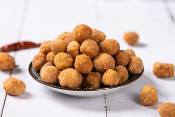 flavored peanuts or crunchy Peanut in a plate on table.