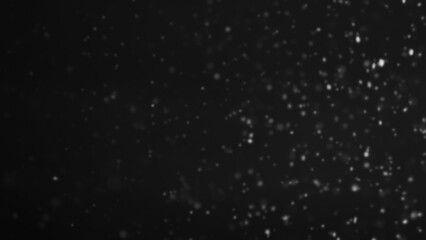 Snowfall particles. Winter storm. Abstract illustration of glowing soft snow falling cold night sky on dark free space background.