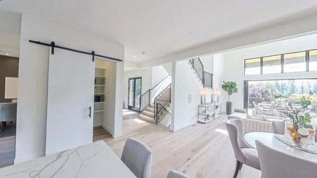 360-degree rotational view of a modern luxury home interior kitchen and living room area; seamless loop