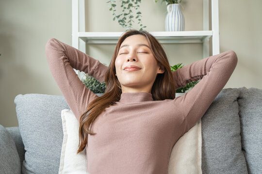 woman relaxing on sofa