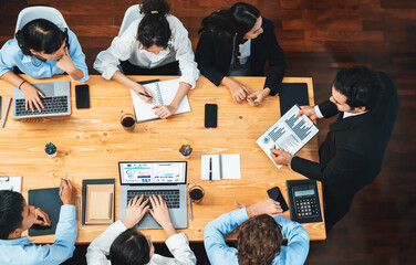 Panorama top view diverse group of business analyst team analyzing financial data report paper on...