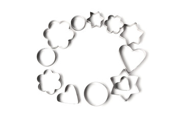 Frame made from cookie cutters isolated on white background