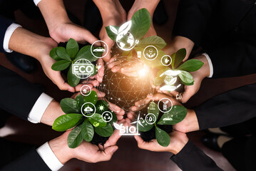 Business partnership nurturing or growing plant together with carbon icon symbolize ESG sustainable...