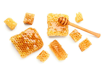 Sweet honeycombs and dipper on white background