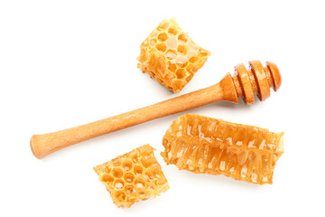 Sweet honeycombs and dipper on white background