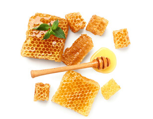 Sweet honeycombs and dipper on white background