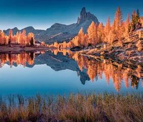 Peel and stick wall murals Reflection Huge mountain peak reflected in the calm waters of Federa lake. Calm autumn scene of Dolomite Alps with orange larch trees on the shore. Colorful morning view of Italy, Europe.