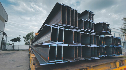 Steel beams production. Metal girders stack on project construction , steel h-beam, selective...