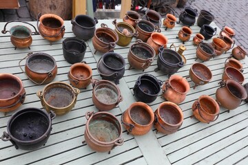 copper vases and cauldrons for sale in the antique dealer s stall in the outdoor flea market
