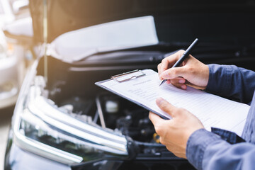 close up of a person writing on a document