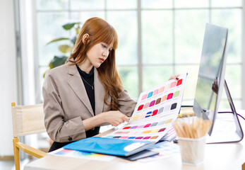 Asian stressed depressed upset young female businesswoman creative graphic designer in casual...