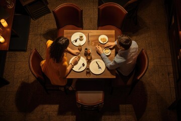 Top view of young couple having romantic dinner in restaurant, looking at each other, Couple Having Dinner Date at Restaurant, top view, AI Generated