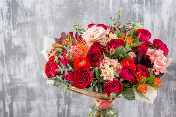 Small Beautiful bouquet of mixed flowers in vase. Floral shop concept . Beautiful fresh cut bouquet. Flowers delivery