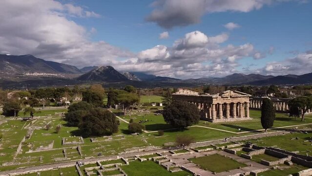 Aerial view of well conserved Greek temples in Paestum archaeological park (southern Italy). Pan and gru move.