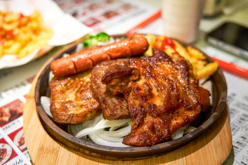 Delicious sizzling beef, chicken, and pork chops in a Hong Kong tea restaurant