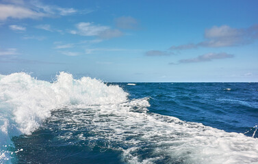 The wake of a speedboat, selective focus.