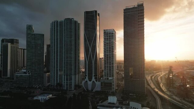 Panoramic Aerial Drone Shot of Miami Downtown at Sunset  Skyscrapers and Highway Traffic, USA