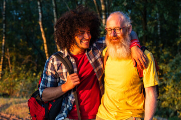 A heartwarming moment captured as a father and son share a loving hug while on a bonding hiking...