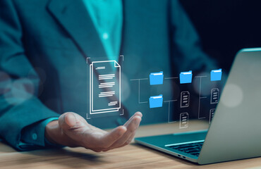 businessman manages data on a laptop, a concept Enterprise Resource Planning system or ERP, software for management recorded in a Database. Business paperless document files digital and electronic.