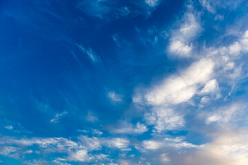 Landscape with Altocumulus and Cirrocumulus white clouds against a beautiful blue sky background....