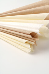 Beige paper napkins on white background studio shot