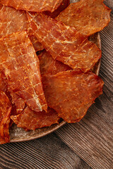 Snack for Beer. Cured Meat Chips with Seasonings on Gray Plate.