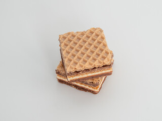 Delicious chocolate wafers with hazelnuts on a white background. Wafers with chocolate and nuts.