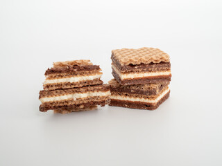 Delicious chocolate wafers with hazelnuts on a white background. Wafers with chocolate and nuts.