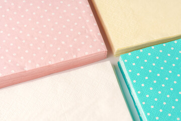 Colorful square paper napkins background top view