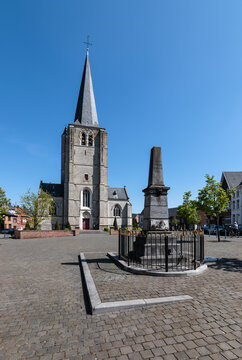 Heist-op-den-Berg, Belgium - April 23, 2020: Bluestone pump war memorial that honoring veterans from 1830. Monument in front of church in Heist-op-den Berg.
