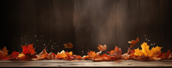 Autumn leaves on wooden table top view. maple orange leaf on old board. Falling leaves natural background.