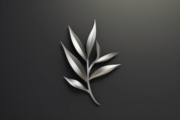 A metallic hard-edge logo for a leaf or plant