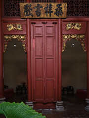 Ancient wooden doors with traditional decorative. Vintage nyonya baba houses in George Town. Vintage door decor in penang.