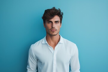 Fototapeta premium Attractive young man on blue wall. Fashion person at summer time. Generate Ai