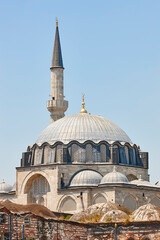 Fototapeta na wymiar Rustem Pasa mosque dome and minaret. Istanbul historic center. Turkey