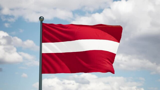 Latvian flag flutters in the wind. Latvia national flag of european country. Cloudy sky background.