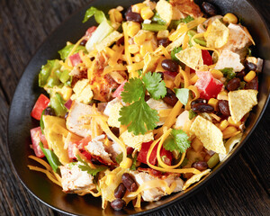 mexican rotisserie chicken salad in black bowl
