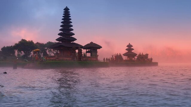 Bali temple Pura Ulun Danu Bratan on lake water at sunset