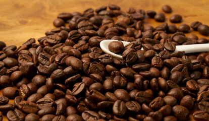 Black coffee and coffee beans on Wooden table