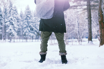 Bearded man in the winter woods. Attractive happy young man with beard walk in the park.
